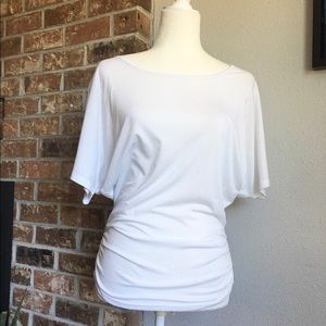 White dolman sleeve top.